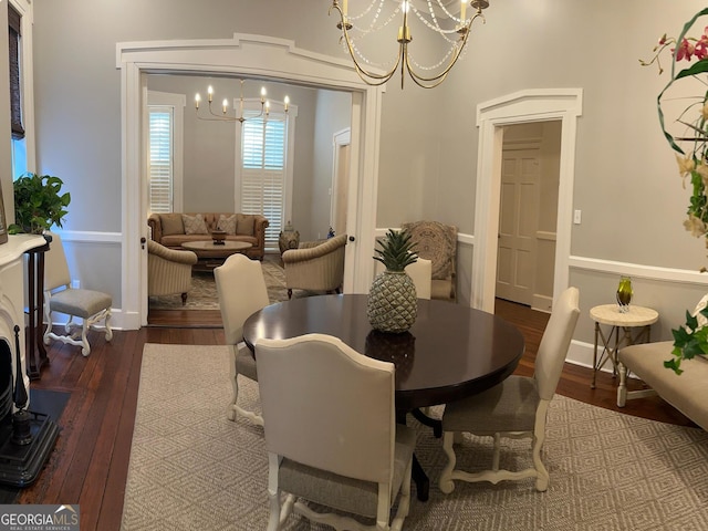 204 E Liberty St, Savannah, GA 31401 - dining room featuring a chandelier, wood-type flooring, and baseboards