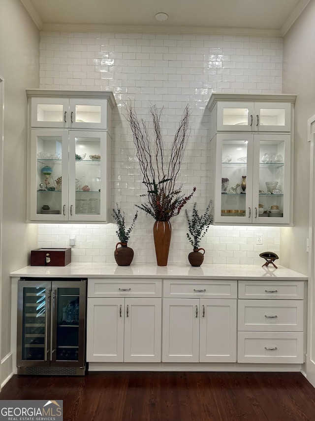 204 E Liberty St, Savannah, GA 31401 - indoor bar with beverage cooler, crown molding, tasteful backsplash, and dark wood finished floors