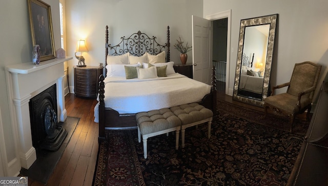 204 E Liberty St, Savannah, GA 31401 - bedroom featuring hardwood / wood-style flooring and a fireplace with raised hearth