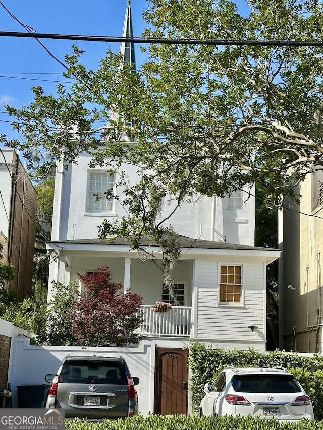 204 E Liberty St, Savannah, GA 31401 - view of front of property with a porch and stucco siding