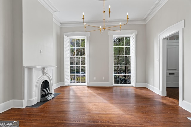 204 E Liberty St, Savannah, GA 31401 - unfurnished living room with ornamental molding, a chandelier, wood finished floors, and a fireplace with flush hearth