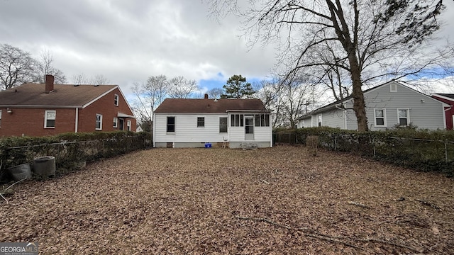 back of house featuring a fenced backyard