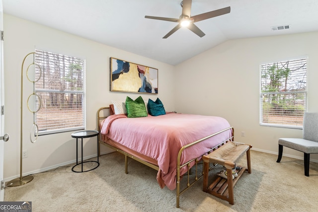 bedroom with baseboards, visible vents, a ceiling fan, lofted ceiling, and carpet floors