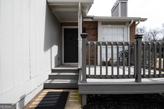 entrance to property with brick siding