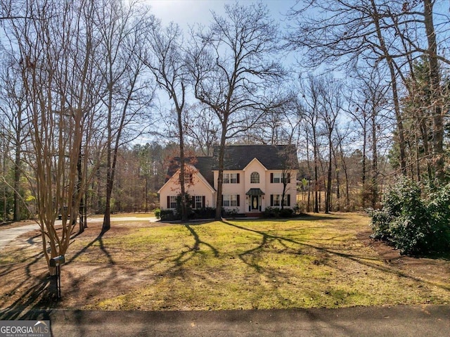 view of front of property with a front lawn and stucco siding