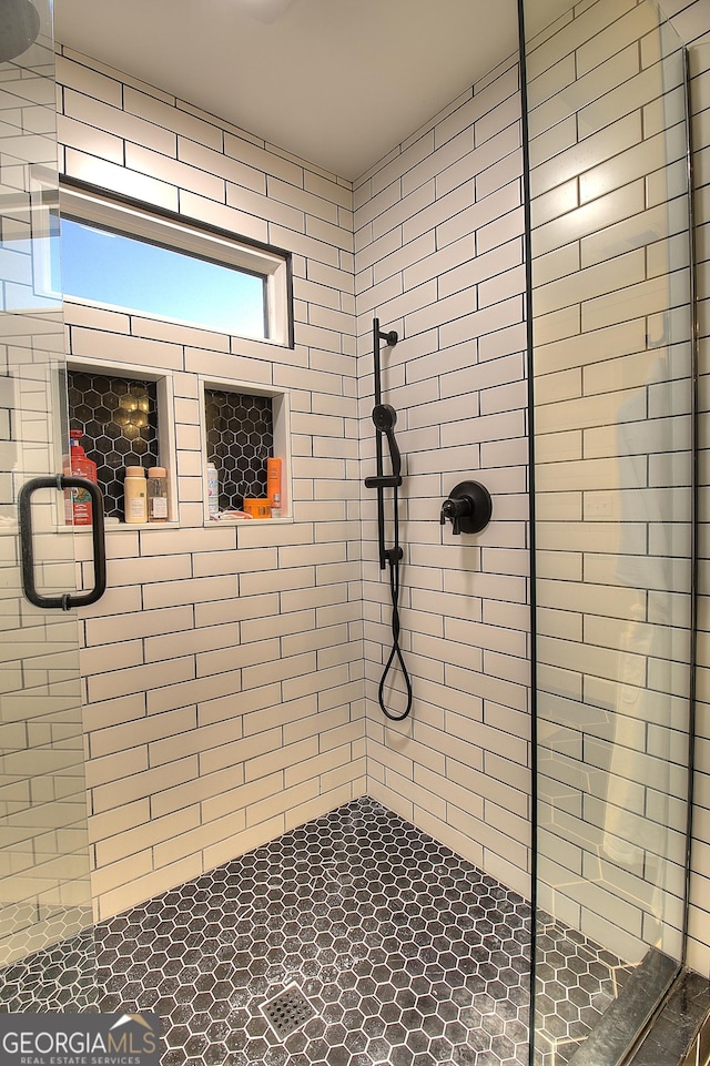 bathroom featuring a shower stall