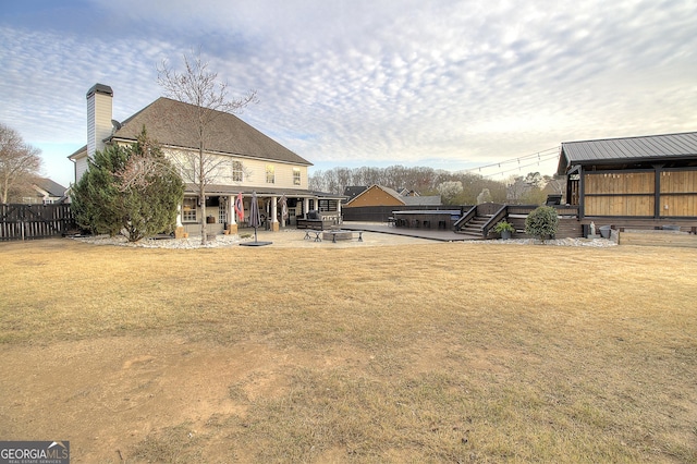 view of yard featuring fence and a patio