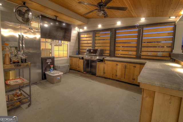 miscellaneous room with ceiling fan, wood ceiling, and vaulted ceiling