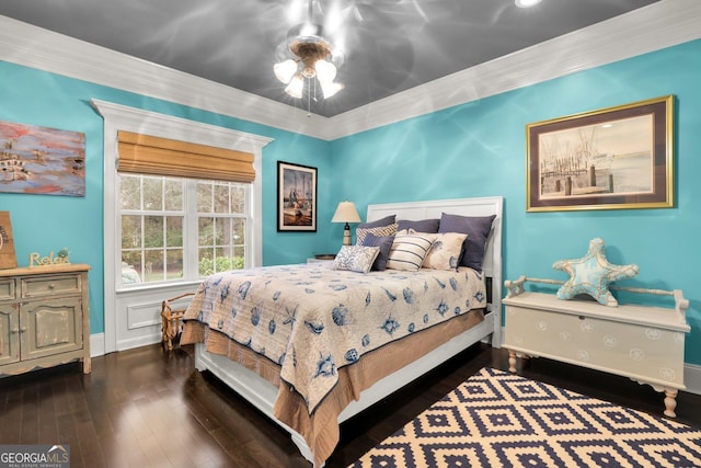 bedroom with ceiling fan, baseboards, wood finished floors, and ornamental molding