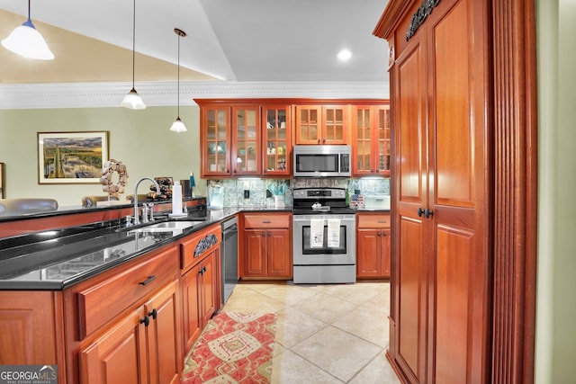 kitchen featuring decorative light fixtures, crown molding, light tile patterned floors, appliances with stainless steel finishes, and a sink