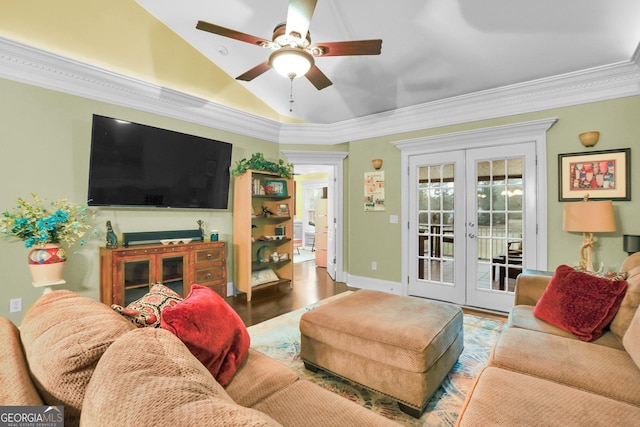 living area featuring lofted ceiling, ornamental molding, wood finished floors, and french doors