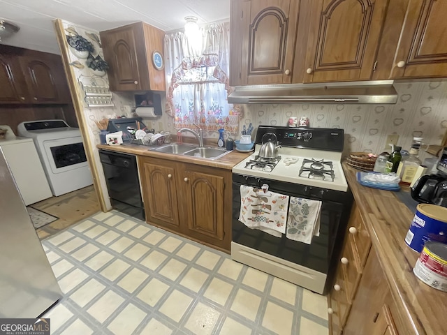 kitchen with under cabinet range hood, independent washer and dryer, dishwasher, gas stove, and wallpapered walls