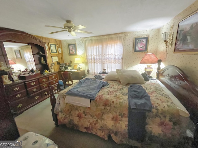 carpeted bedroom featuring ceiling fan and wallpapered walls