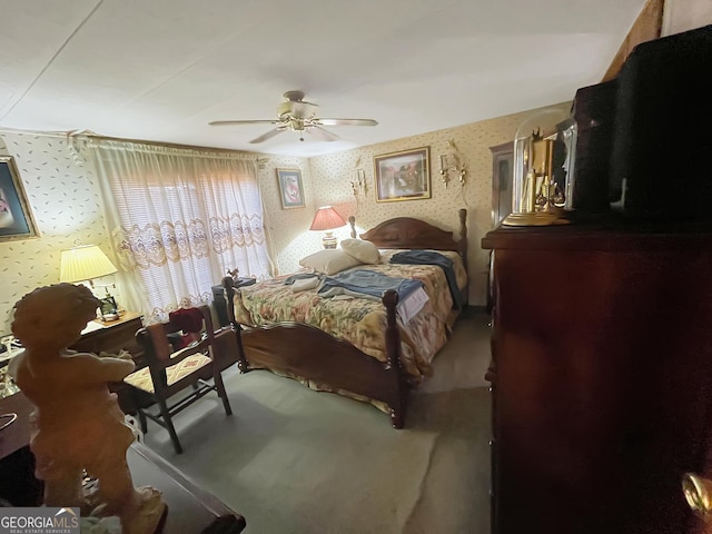 bedroom featuring wallpapered walls and a ceiling fan