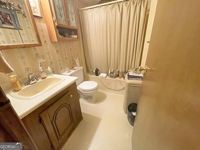 bathroom with toilet, wallpapered walls, vanity, and a shower with shower curtain