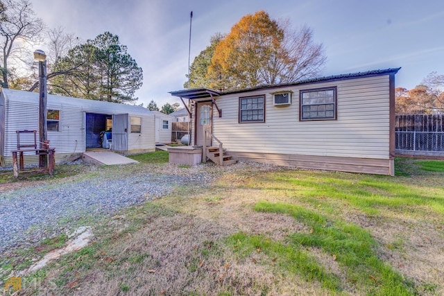 rear view of house with fence