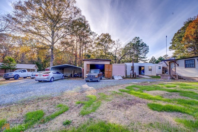 exterior space featuring driveway and a detached carport