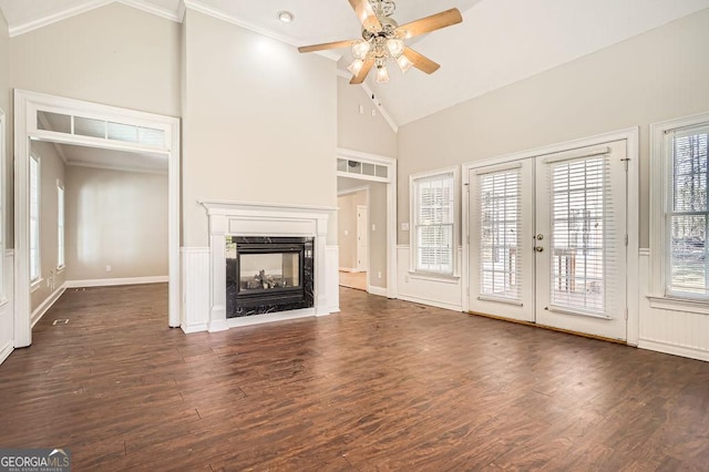 unfurnished living room featuring dark wood-style floors, french doors, ceiling fan, high vaulted ceiling, and a multi sided fireplace