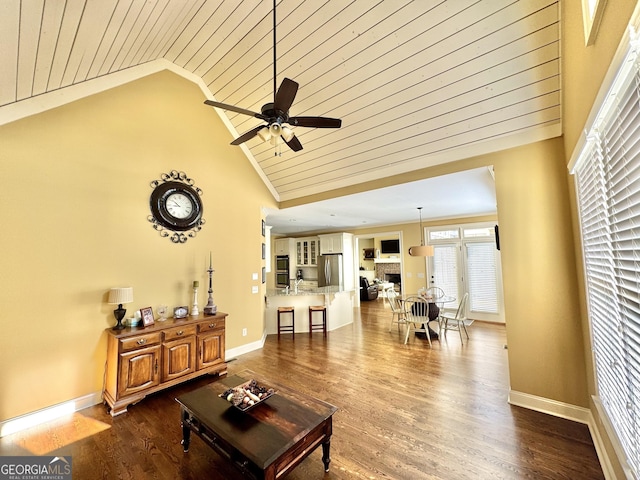 living room featuring crown molding, baseboards, and dark wood-style flooring