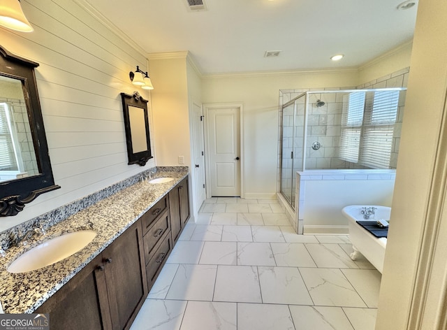 full bathroom featuring a shower stall, marble finish floor, a sink, and crown molding