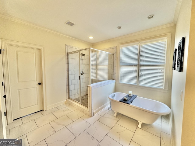 full bathroom with marble finish floor, a shower stall, crown molding, and a soaking tub