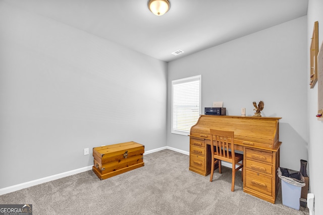 office area with carpet flooring, visible vents, and baseboards