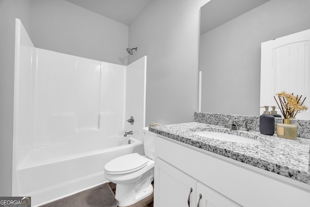 bathroom with shower / washtub combination, vanity, and toilet