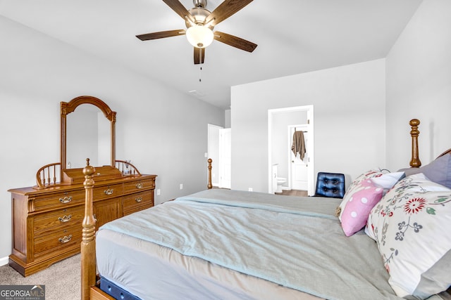 carpeted bedroom featuring a ceiling fan and ensuite bathroom