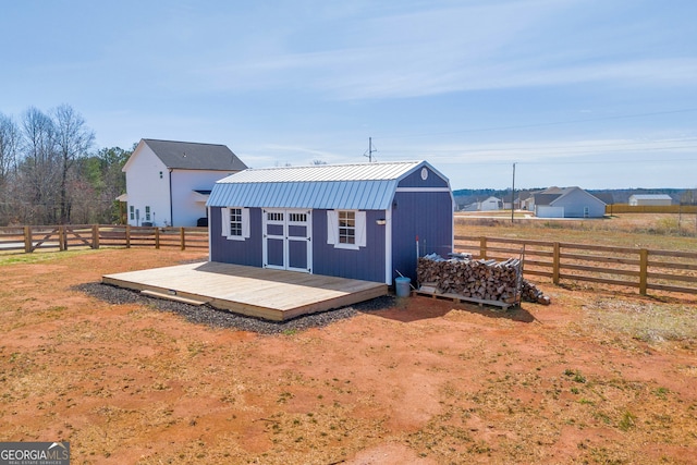 view of shed featuring a fenced backyard