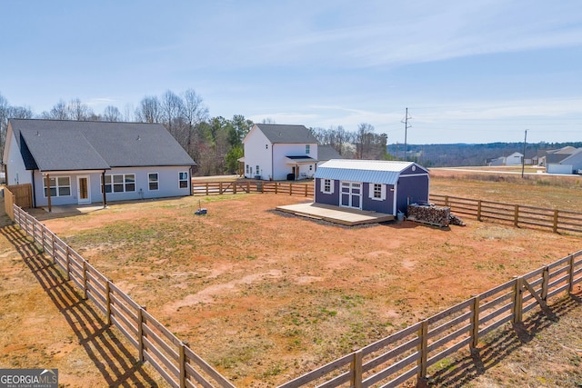 view of yard featuring a fenced backyard and an outdoor structure