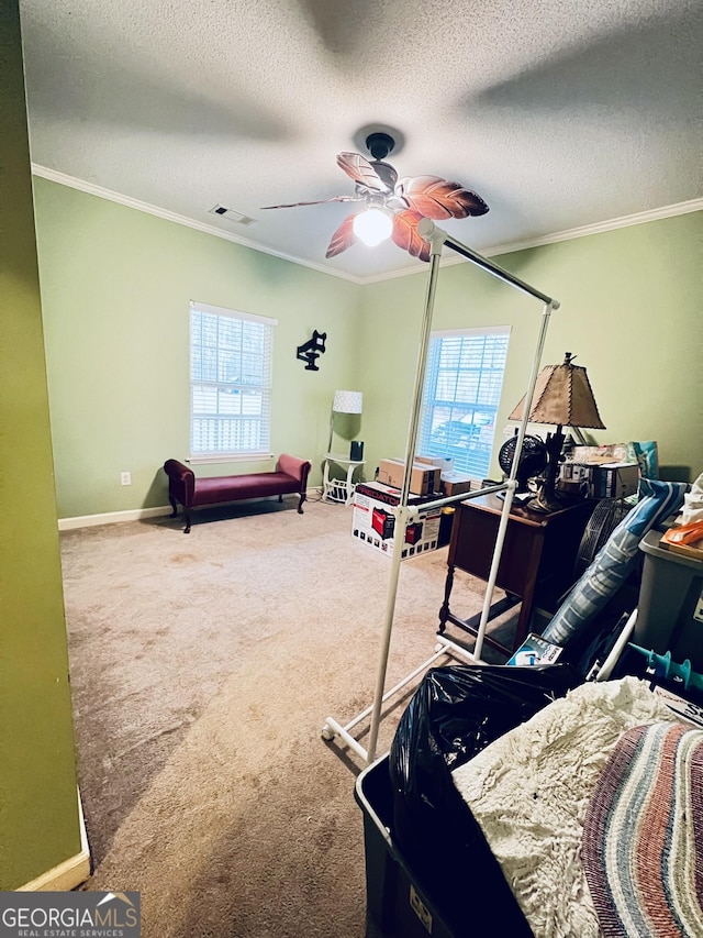 bedroom featuring carpet floors, visible vents, crown molding, and baseboards