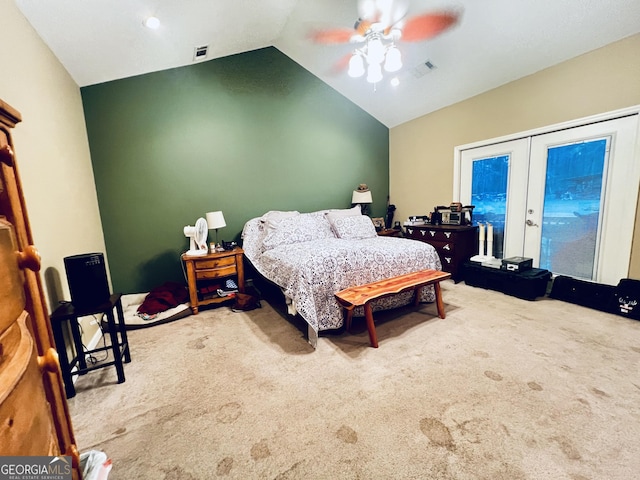 bedroom featuring lofted ceiling, french doors, carpet flooring, and visible vents