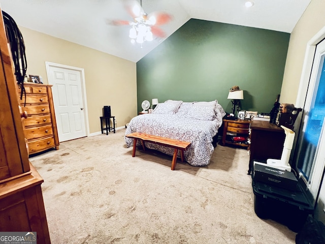 carpeted bedroom with lofted ceiling, ceiling fan, and baseboards