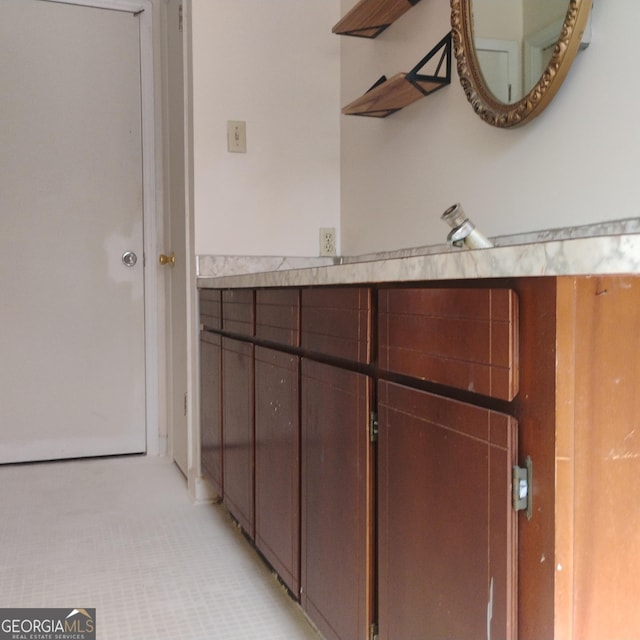 interior space featuring light countertops and light tile patterned flooring