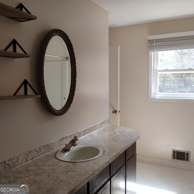 bathroom with vanity and visible vents