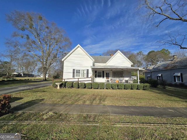 view of front of property with a front lawn and a porch