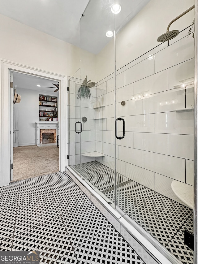 full bathroom with a fireplace and a shower stall