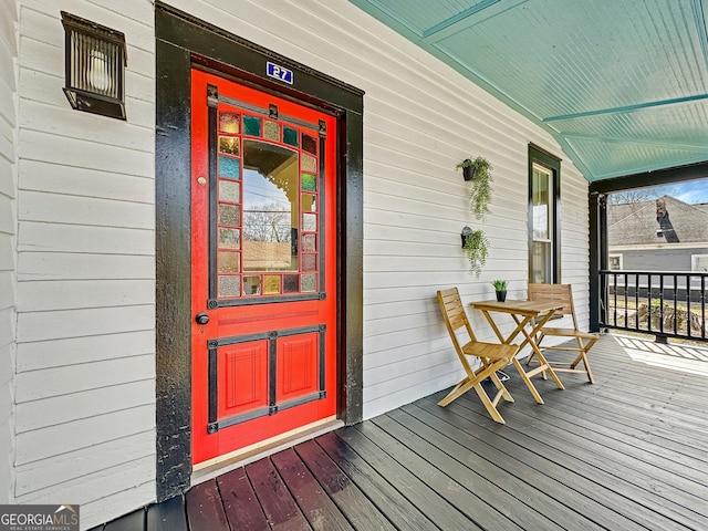 doorway to property featuring covered porch