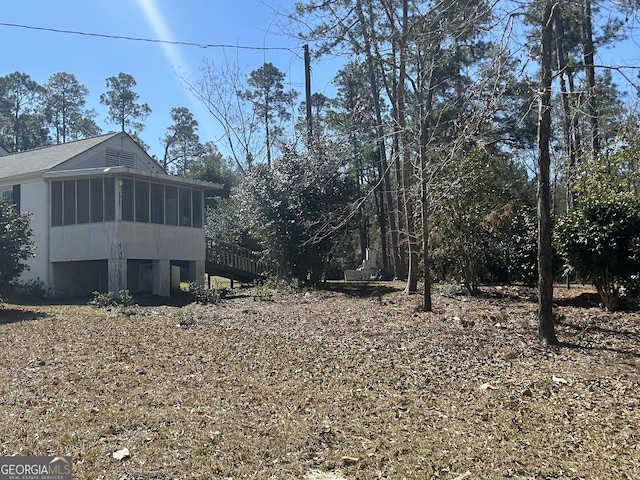 view of yard with a sunroom