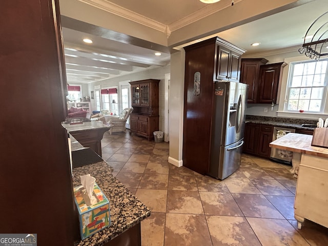 kitchen with recessed lighting, dark brown cabinetry, appliances with stainless steel finishes, crown molding, and open floor plan