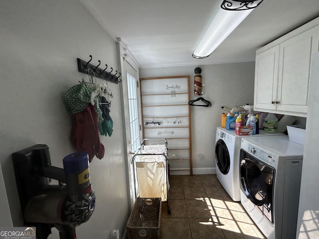 laundry room featuring tile patterned floors, cabinet space, and separate washer and dryer