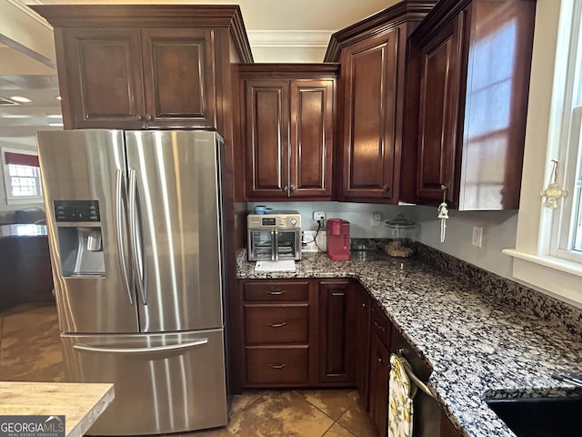 kitchen with dark brown cabinets, ornamental molding, dishwashing machine, dark stone countertops, and stainless steel refrigerator with ice dispenser