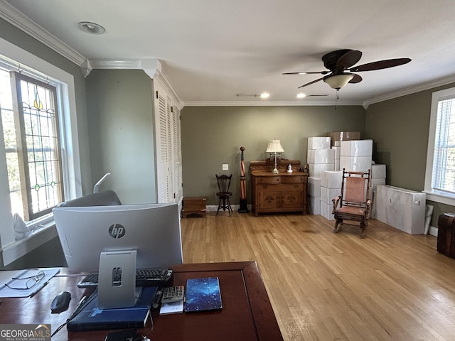 office with baseboards, crown molding, ceiling fan, and wood finished floors