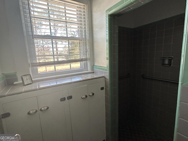 full bath featuring a shower stall