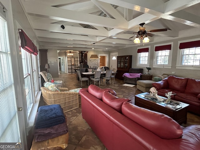 tiled living room featuring lofted ceiling with beams and a ceiling fan