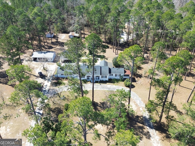 aerial view with a wooded view