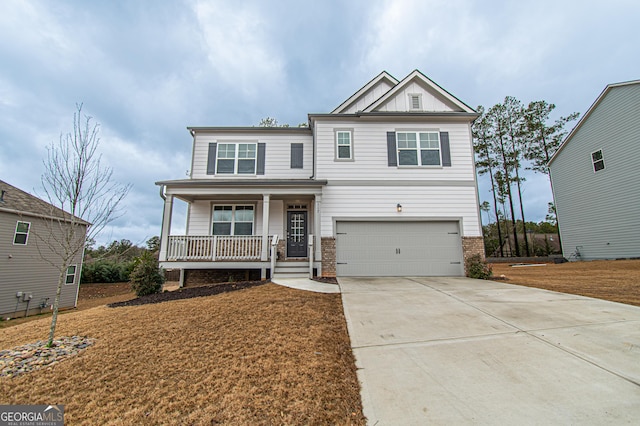 craftsman inspired home with board and batten siding, a porch, driveway, and an attached garage