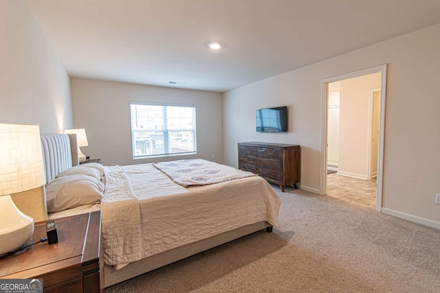 bedroom with visible vents, baseboards, and carpet flooring