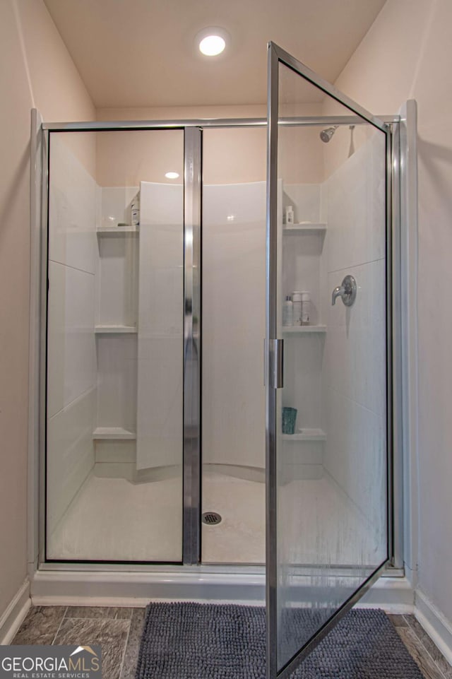 bathroom featuring a shower stall