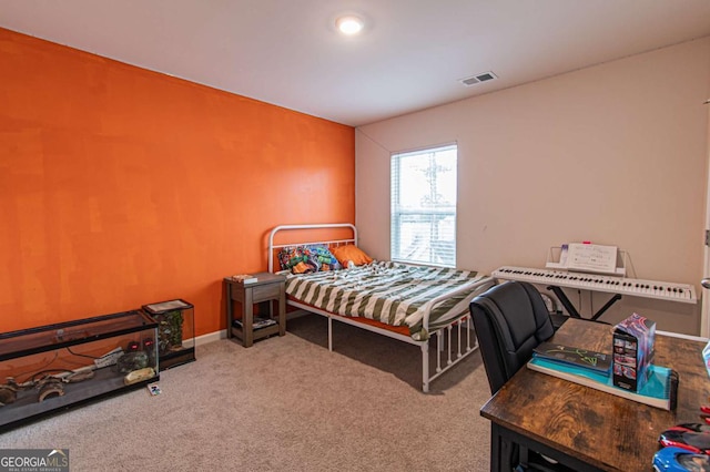 bedroom with carpet floors and visible vents